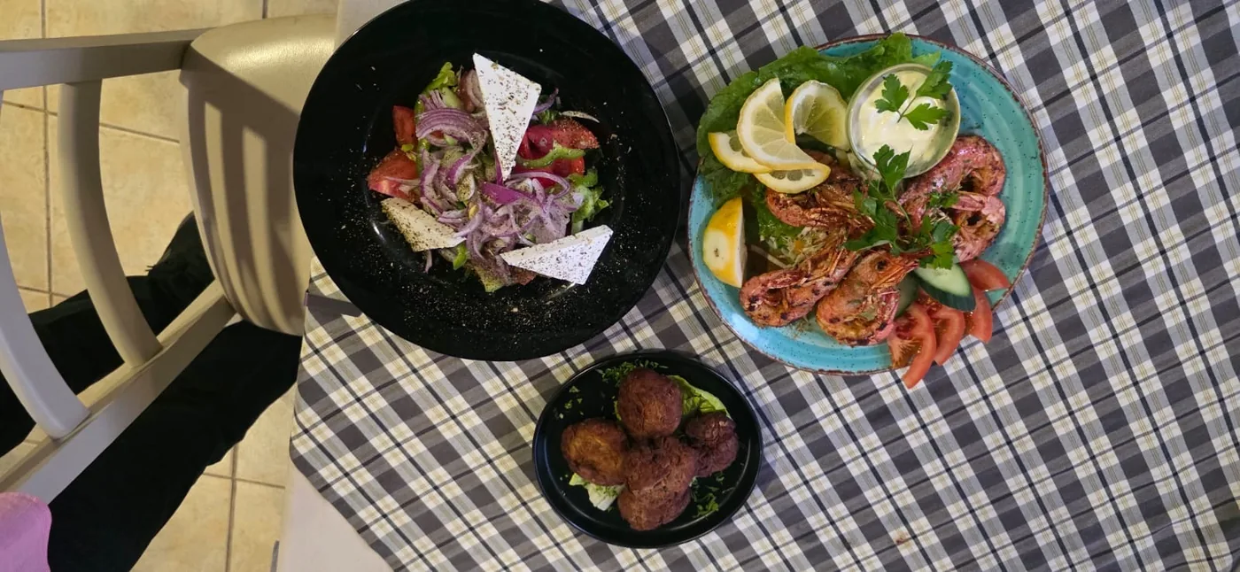 Grilled king prawns with Greek salad and keftedes